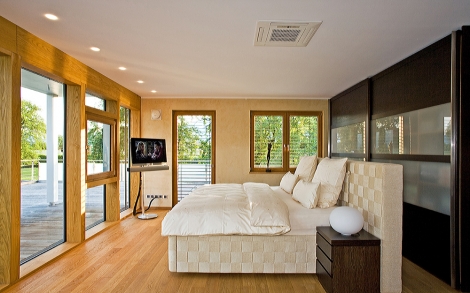 Architektenhaus von BAUFRITZ Luxushaus Tessin Der Master Bedroom im